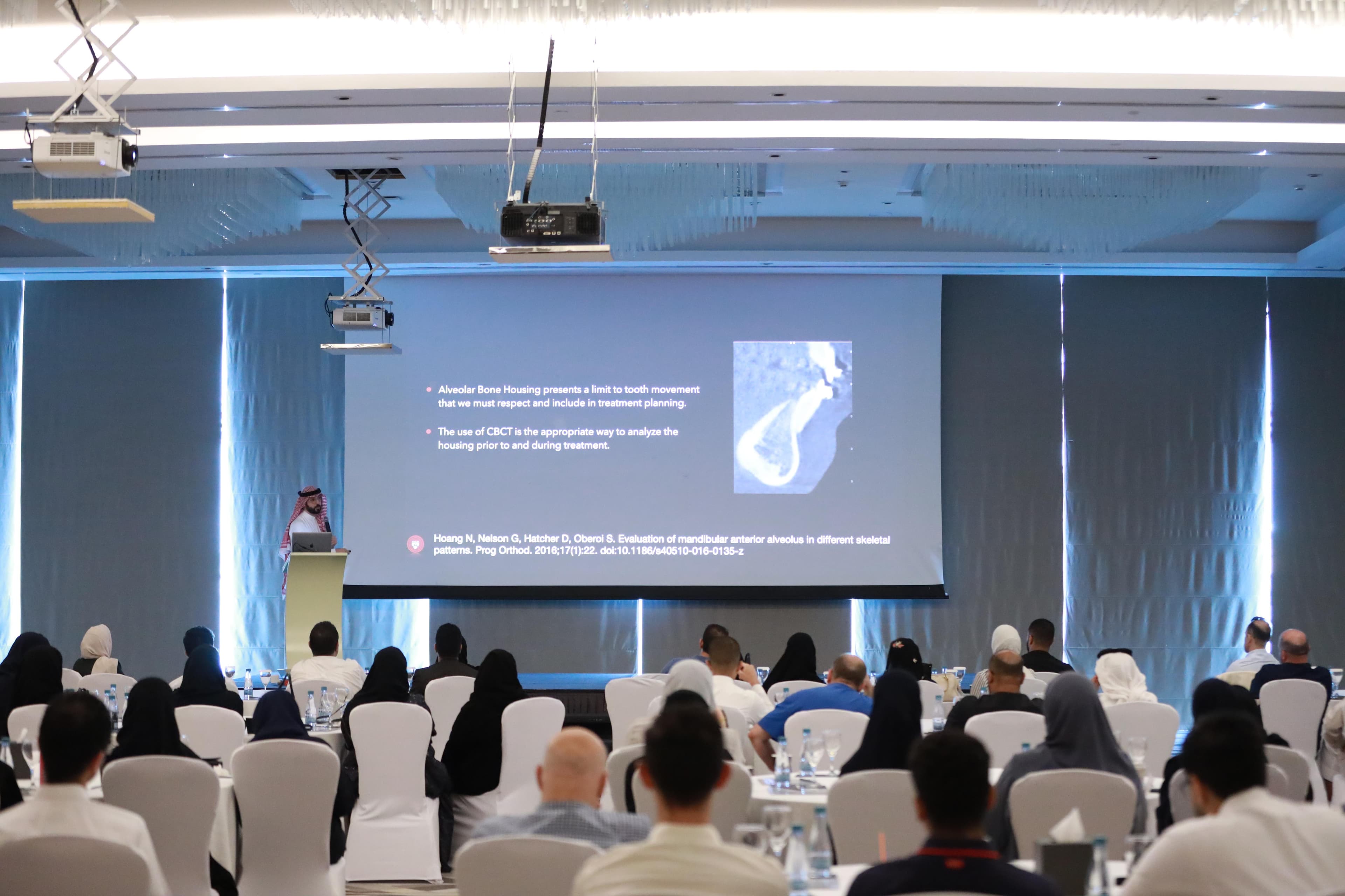 Dr. Qali presenting a lecture